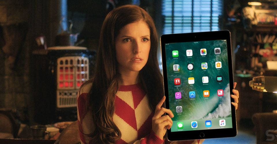 Noelle holding up an iPad